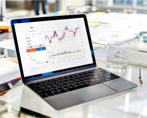 A laptop screen showing graphs